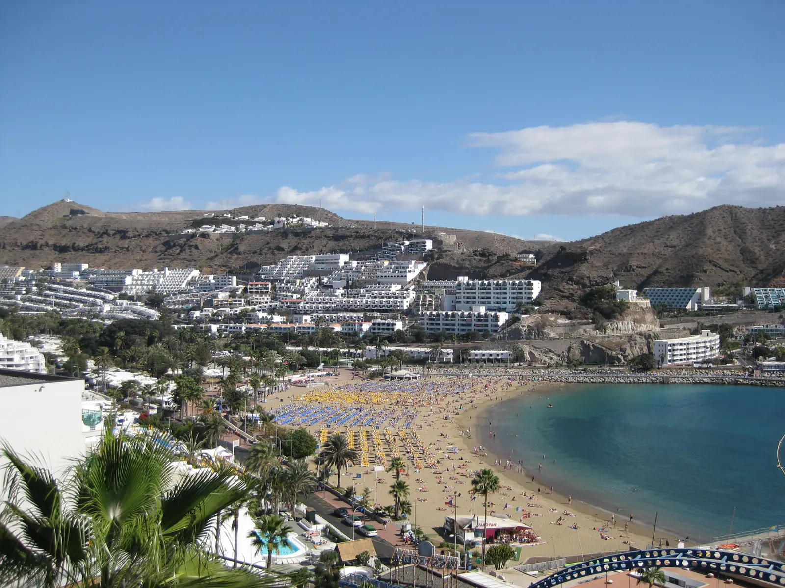 Puerto Rico bay with its golden sand beach and apartment blocks climbing the hillside